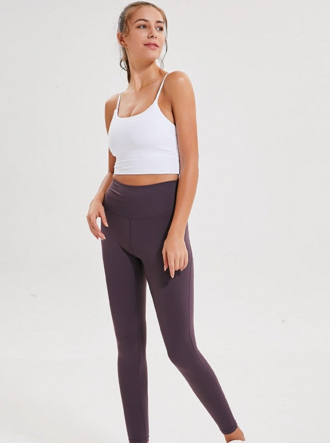 Top corto deportivo sin mangas para yoga de color morado claro