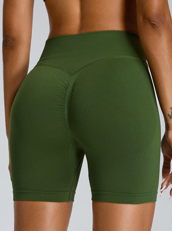 Pantalones cortos deportivos de cintura alta sin costuras que realzan los glúteos en color verde menta 