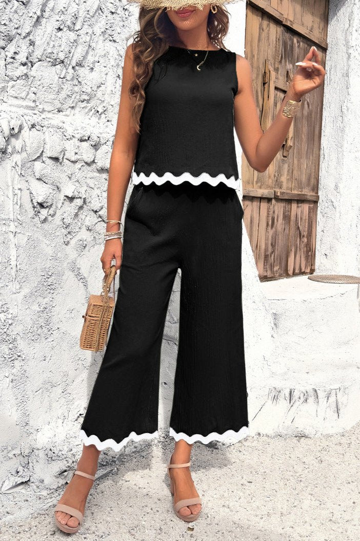 Conjunto de pantalón y blusa sin mangas con dobladillo ondulado de verano en color negro 