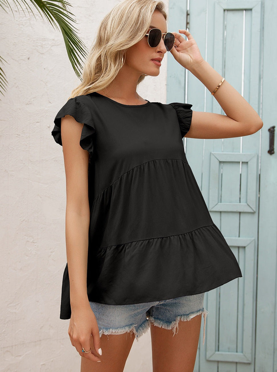 Blusa clásica con volantes en capas