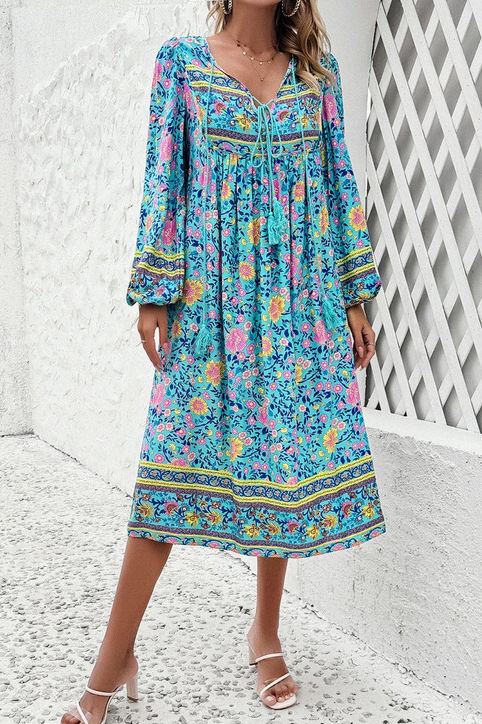 Elegante vestido midi de manga larga con estampado floral azul 