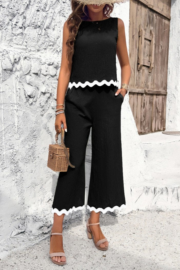 Conjunto de pantalón y blusa sin mangas con dobladillo ondulado de verano en color negro 