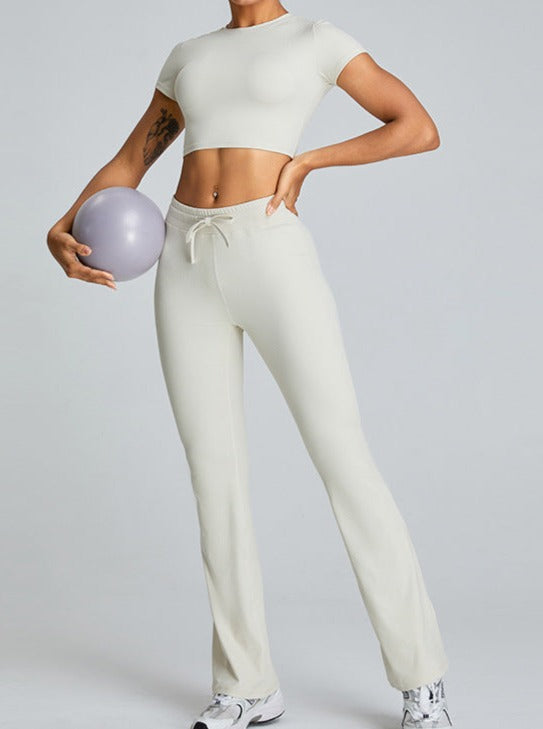 Pantalones de fitness blancos con aberturas y cordón que realzan los glúteos